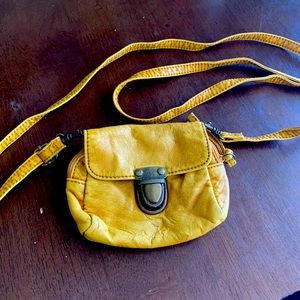 Worn a few times. Mustard crossbody tiny purse